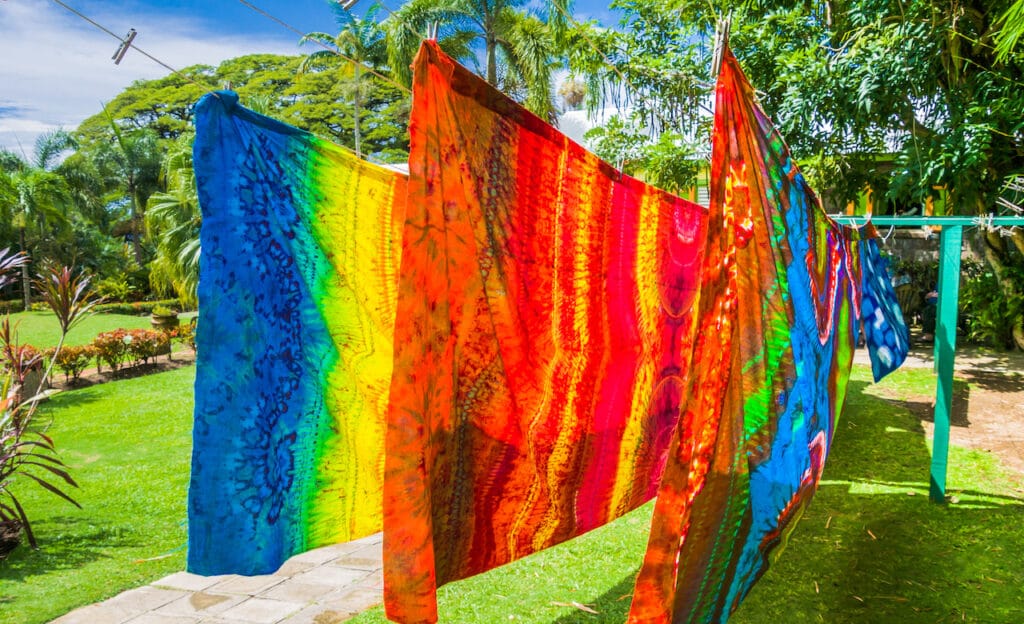 Brightly colored fabric, dyed using the ancient batik technique, on a clothesline in St. Kitts.