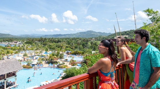 view of the guests looking at the pool area from the balcony