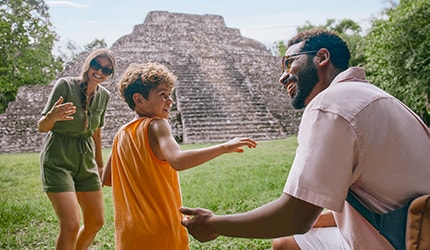 family visiting the ruins in mexico on their carnival cruise