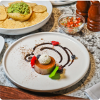 a dessert and chips are served on a dish