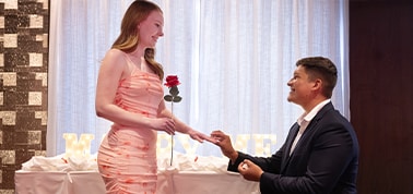 man down on one knee proposing to his girlfriend