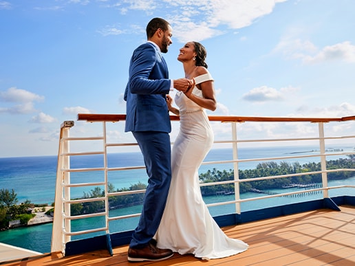 a bride and groom kiss onboard a ship